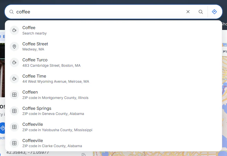 The Maps search box with the word coffee typed in and a list of suggestions below it: a Coffee search-nearby suggestion first, then matching places